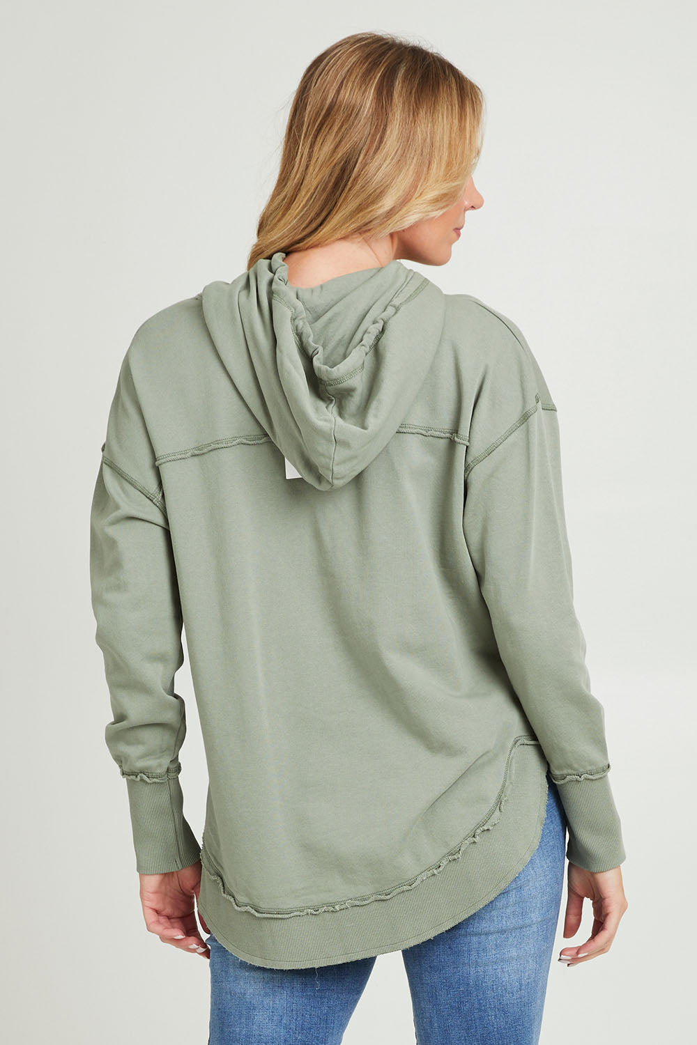 Model Grace wearing size 10 of the Elements Sigrid Hoody in colour Sagegreen (Green), from the back