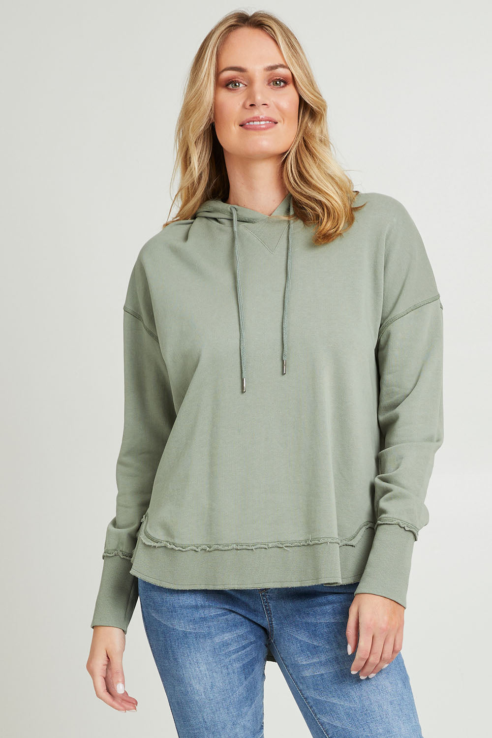Model Grace wearing size 10 of the Elements Sigrid Hoody in colour Sagegreen (Green), from the front, cropped image