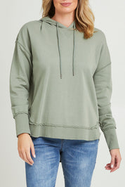 Model Grace wearing size 10 of the Elements Sigrid Hoody in colour Sagegreen (Green), from the front, cropped image