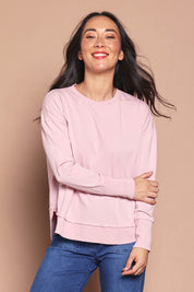 Model Katie wearing size 8 of the Elements Farrah Cotton Long Sleeve in colour Blossompin (White), from the front, cropped image