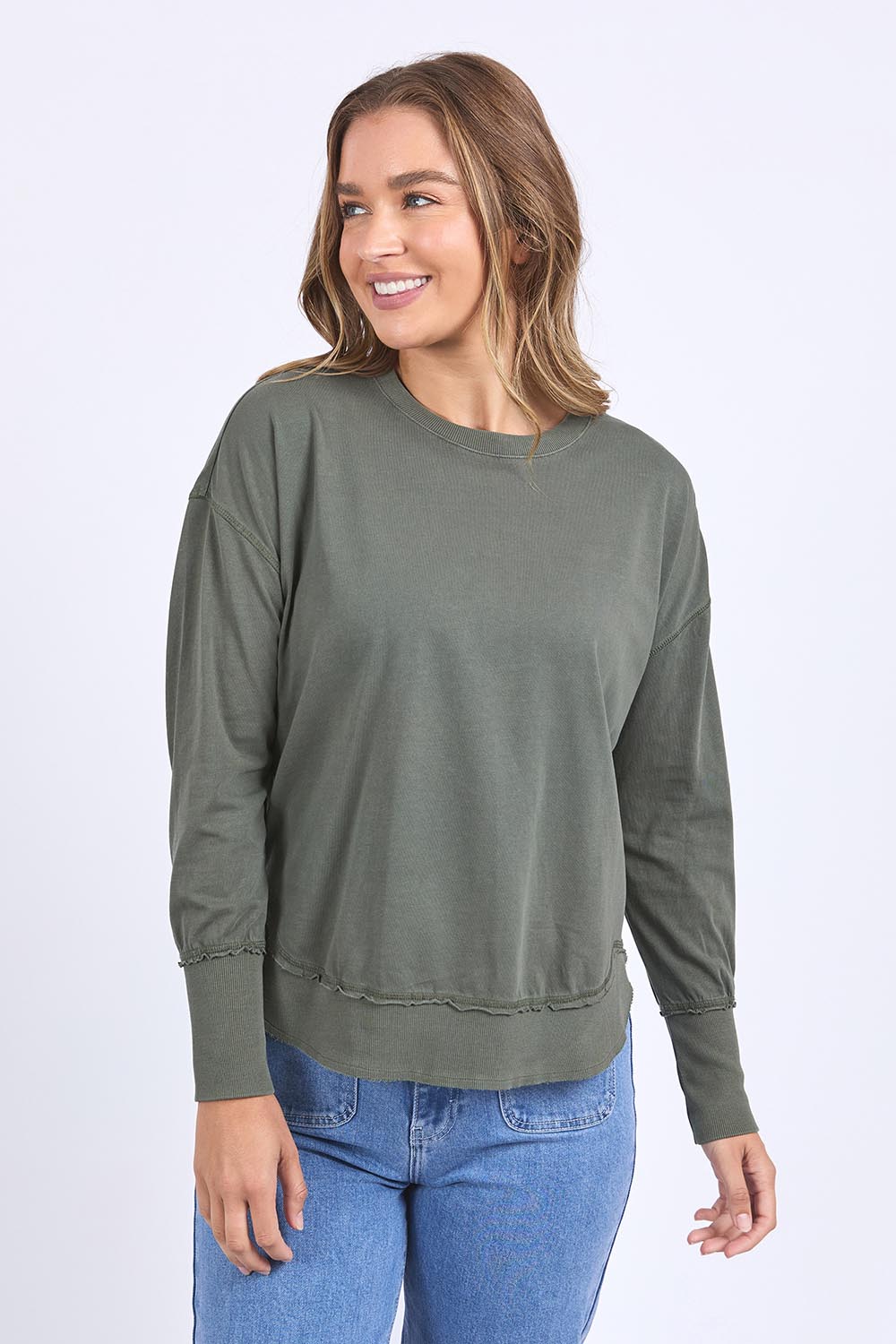 A model wearing the Elements Farrah Cotton Long Sleeve in colour Khaki (Green), from the front, cropped image