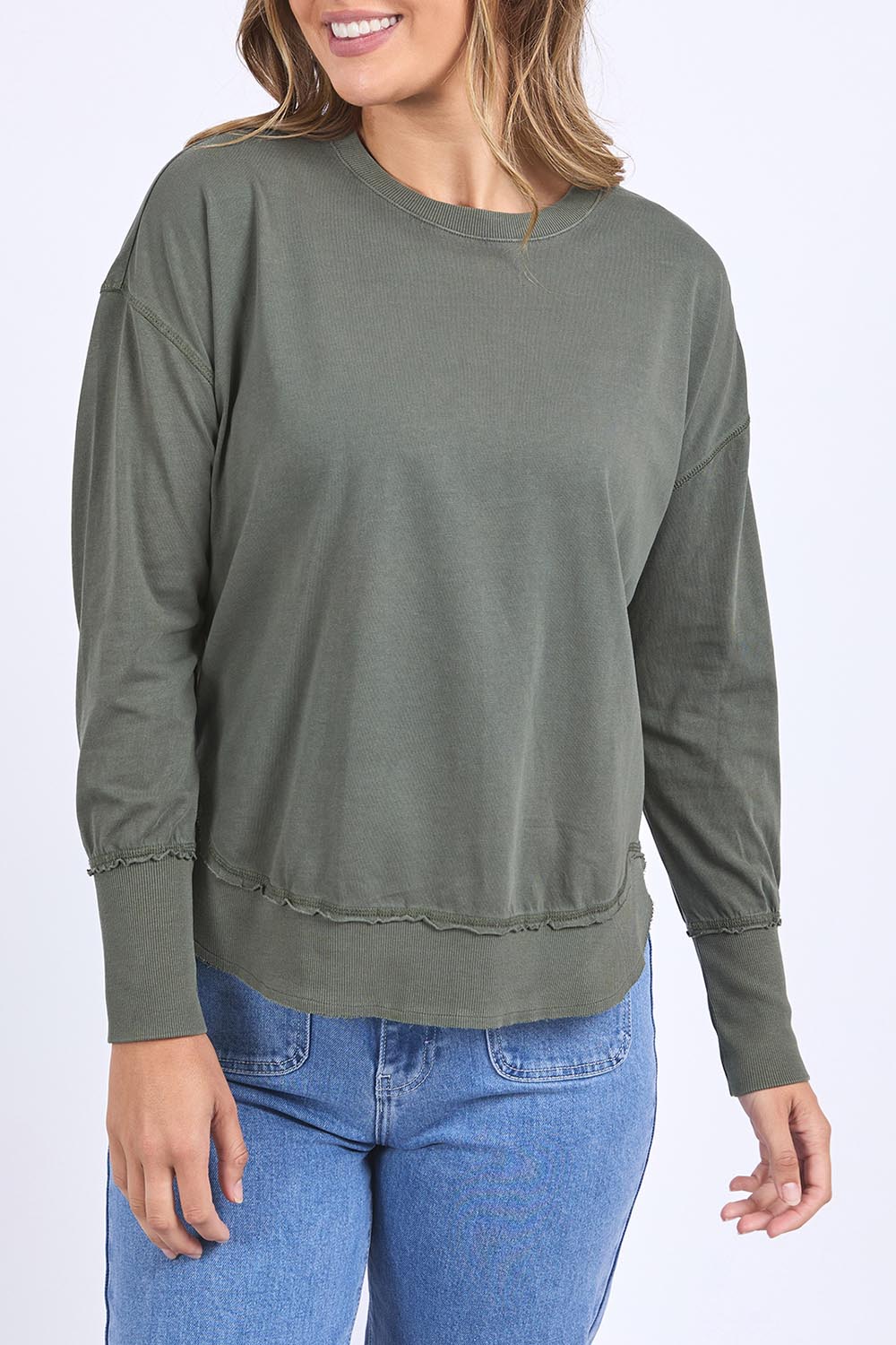 A model wearing the Elements Farrah Cotton Long Sleeve in colour Khaki (Green), from the front, cropped image