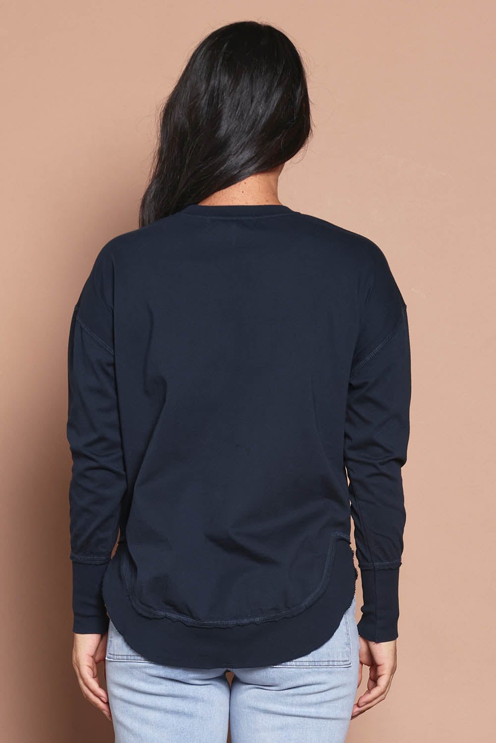Model Katie wearing size 8 of the Elements Farrah Cotton Long Sleeve in colour Navy (Blue), from the back