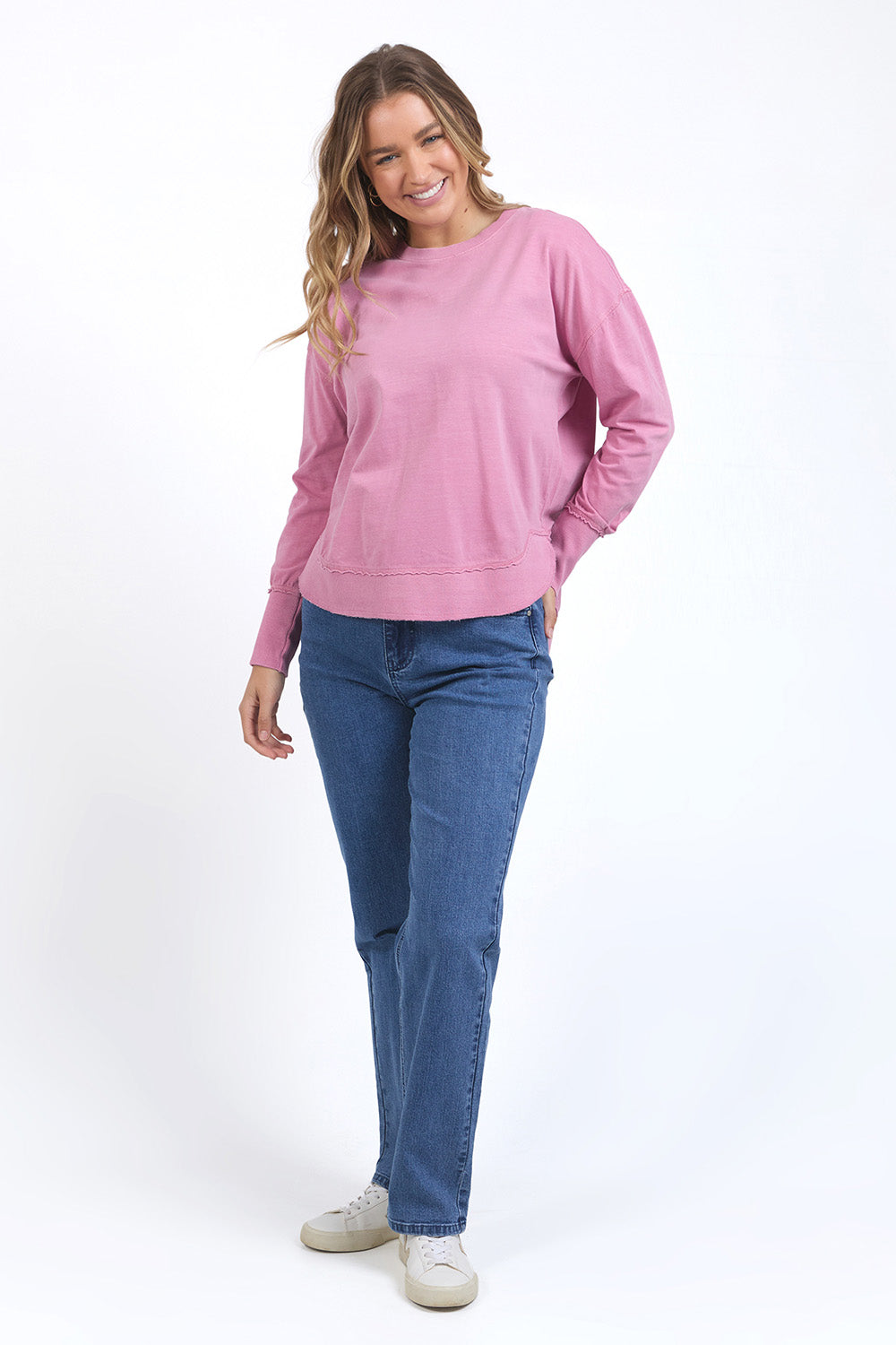 A model wearing the Elements Farrah Cotton Long Sleeve in colour Rosepink (Pink), from the front, showing the whole outfit