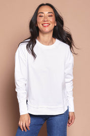 Model Katie wearing size 8 of the Elements Farrah Cotton Long Sleeve in colour White (White), from the front, cropped image