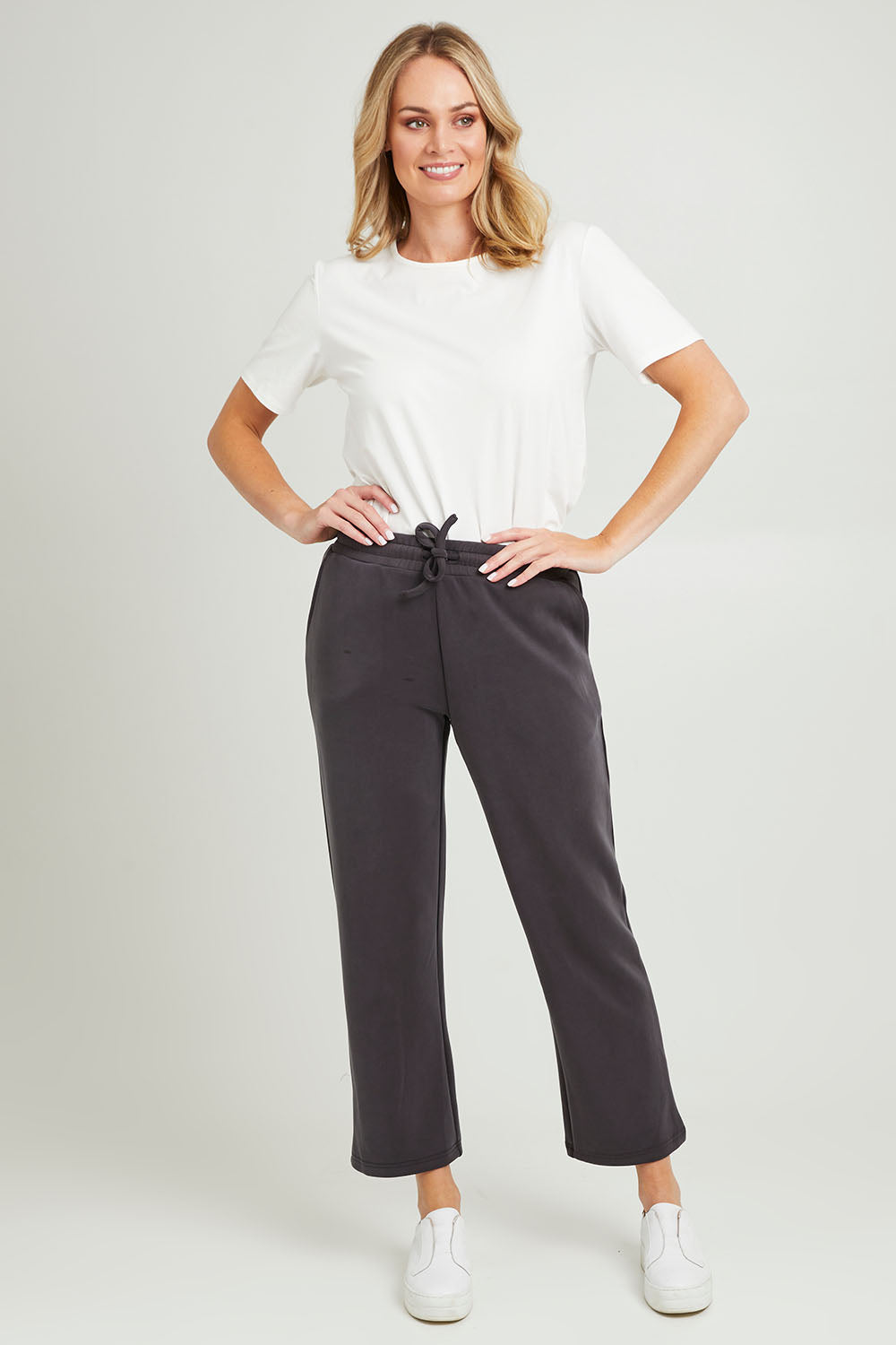 Model Grace wearing size 10 of the Elements Storm Pant in colour Stormblack (Black), from the front, showing the whole outfit
