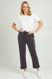 Model Grace wearing size 10 of the Elements Storm Pant in colour Stormblack (Black), from the front, showing the whole outfit