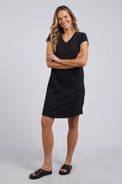 A model wearing the Elements Manly Vee Tee Dress in colour Black (Black), from the front, showing the whole outfit