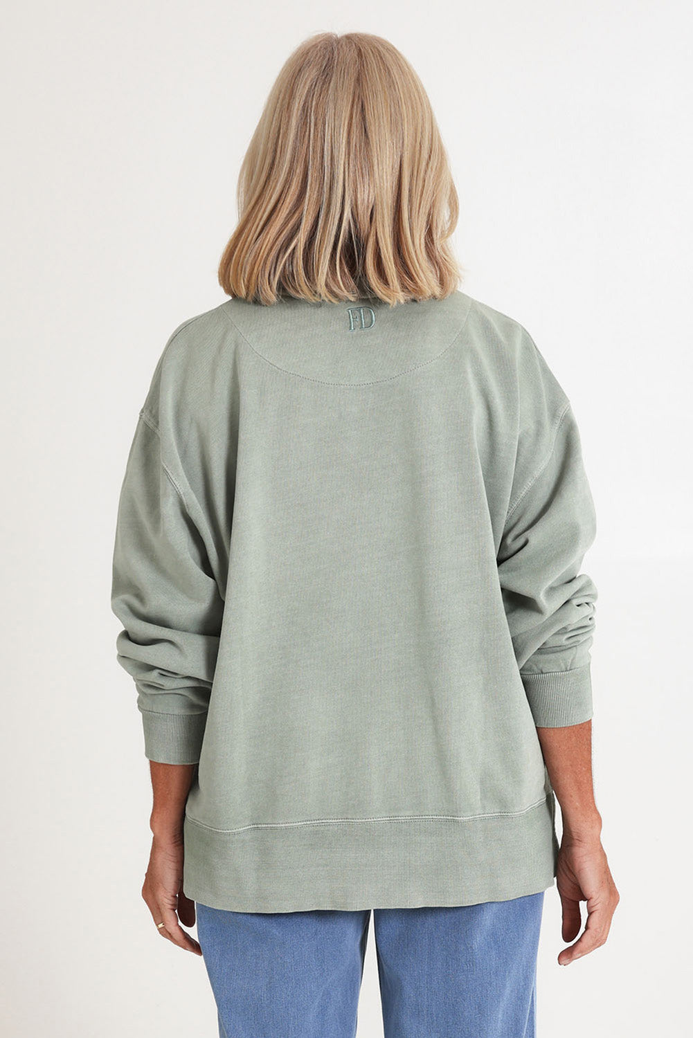 Model Sandy wearing size 10 of the Effortless Cotton Crew in colour Iceburggre (Green), from the back