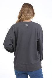 A model wearing the Effortless Cotton Crew in colour Irongrey (Grey), from the back