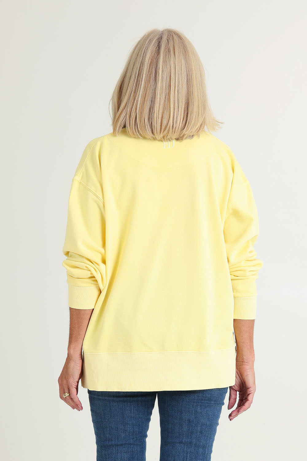 Model Sandy wearing size 10 of the Effortless Cotton Crew in colour Lemon, from the back