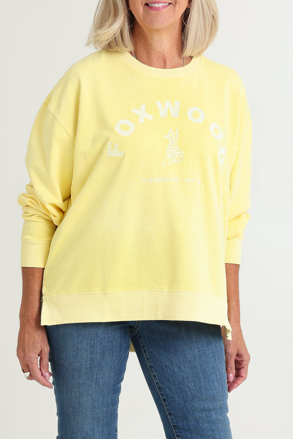 Model Sandy wearing size 10 of the Effortless Cotton Crew in colour Lemon, from the front, cropped image