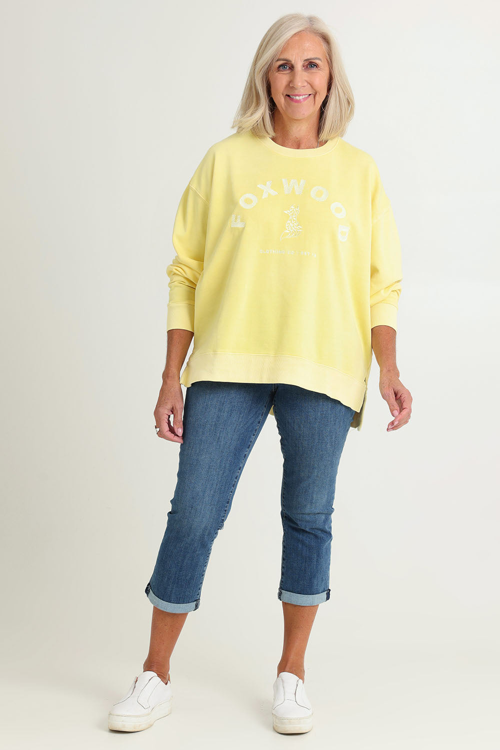 Model Sandy wearing size 10 of the Effortless Cotton Crew in colour Lemon, from the front, showing the whole outfit