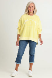 Model Sandy wearing size 10 of the Effortless Cotton Crew in colour Lemon, from the front, showing the whole outfit