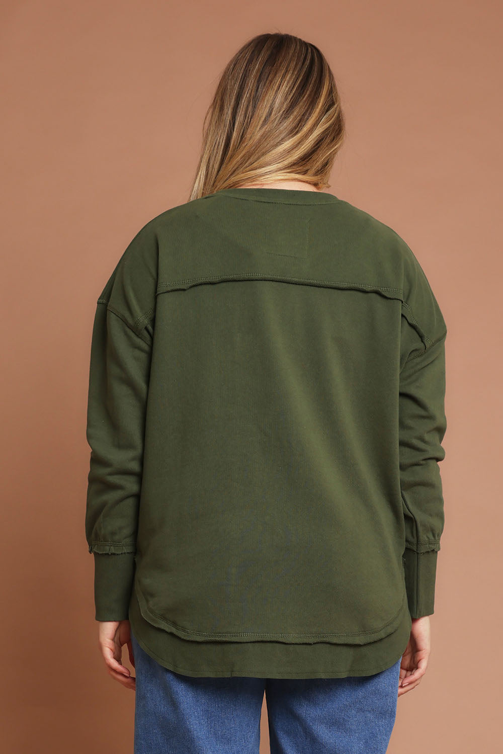 Model Chanel wearing size 14 of the Elements Simplified Metallic Cotton Crew in colour Olivepink (Green), from the back
