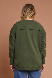 Model Chanel wearing size 14 of the Elements Simplified Metallic Cotton Crew in colour Olivepink (Green), from the back
