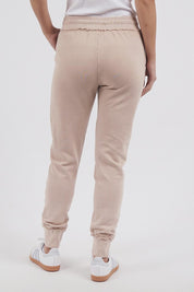 A model wearing the Leisure Simplified Pants in colour Oatmeal, from the back