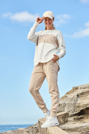 Model Katie wearing size 10 of the Leisure Simplified Pants in colour Oatmeal, from the front, showing the whole outfit