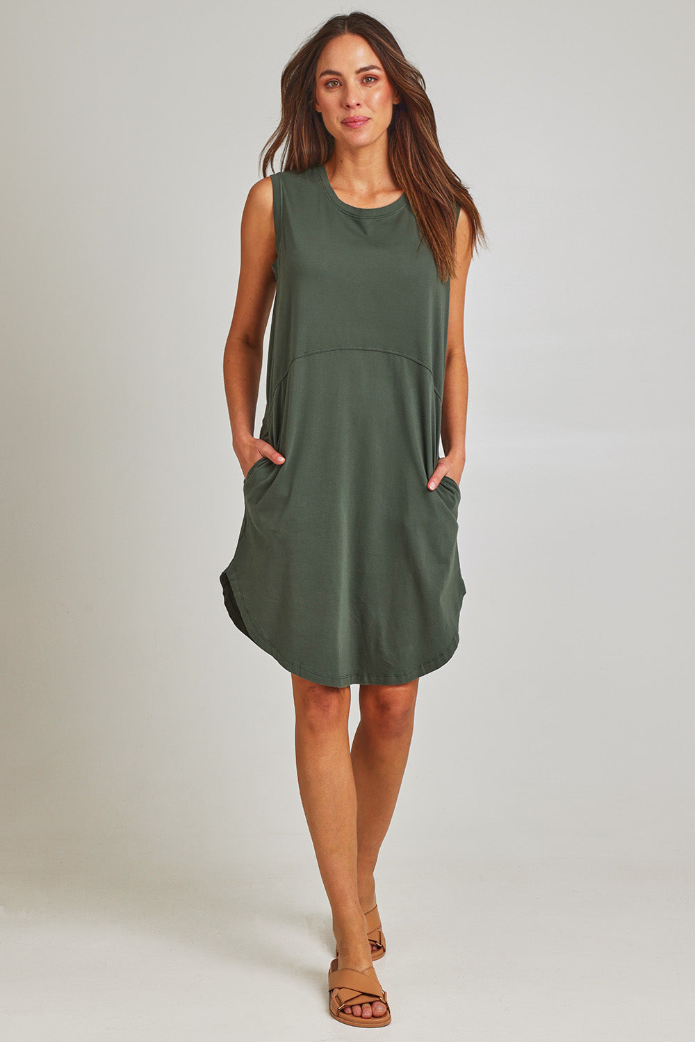Model Madeline wearing size 10 of the Elements Bungalow Dress in colour Khaki (Green), from the front, showing the whole outfit