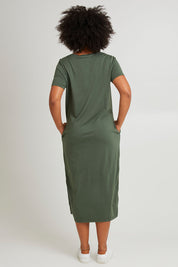 Model Olivia wearing size 10 of the Elements Rhythm Dress in colour Khaki (Green), from the back