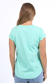 A model wearing the Elements Effortless Tee in colour Neonmint (Green), from the front, cropped image