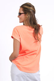A model wearing the Elements Effortless Tee in colour Neonpeach, from the back