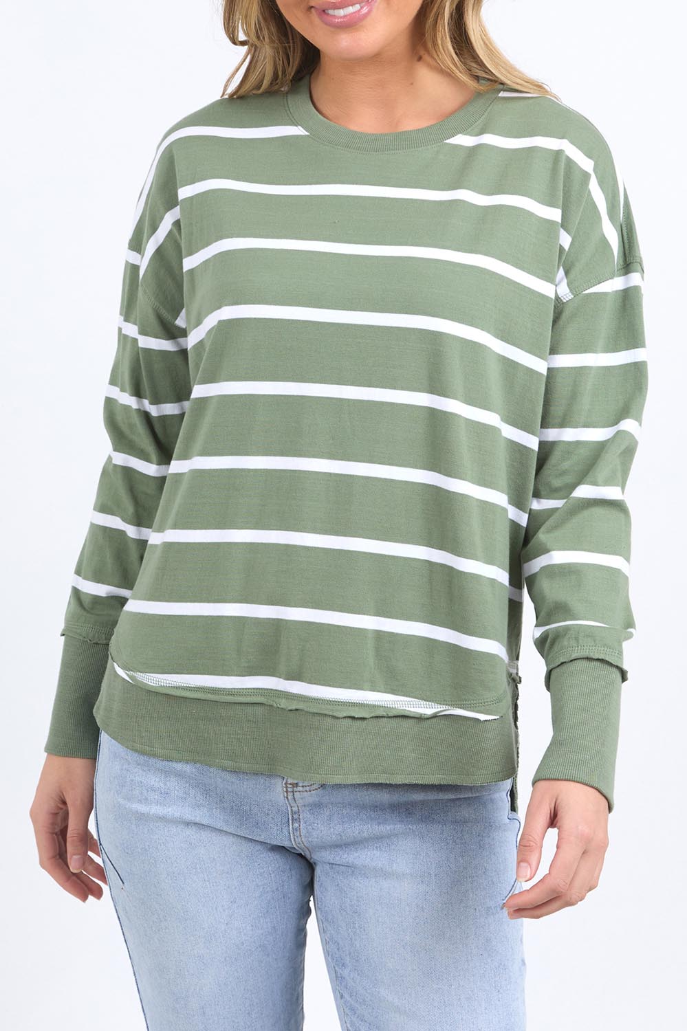 A model wearing the Elements Farrah Stripe Cotton Long Sleeve in colour Sagewhite (Green), from the front, cropped image