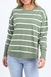 A model wearing the Elements Farrah Stripe Cotton Long Sleeve in colour Sagewhite (Green), from the front, cropped image
