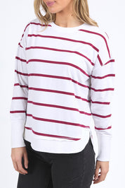A model wearing the Elements Farrah Stripe Cotton Long Sleeve in colour Whibeetred (White), from the front, cropped image