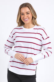 A model wearing the Elements Farrah Stripe Cotton Long Sleeve in colour Whibeetred (White), from the front, cropped image