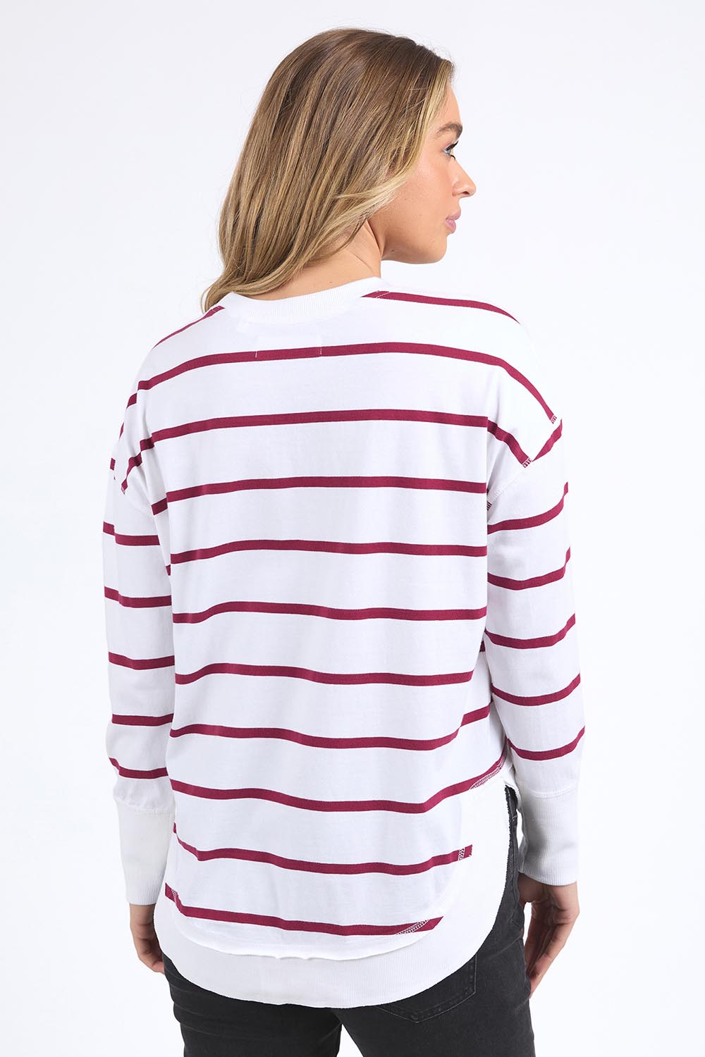 A model wearing the Elements Farrah Stripe Cotton Long Sleeve in colour Whibeetred (White), from the front, cropped image