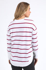 A model wearing the Elements Farrah Stripe Cotton Long Sleeve in colour Whibeetred (White), from the front, cropped image