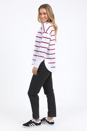 A model wearing the Elements Farrah Stripe Cotton Long Sleeve in colour Whibeetred (White), from the front, showing the whole outfit