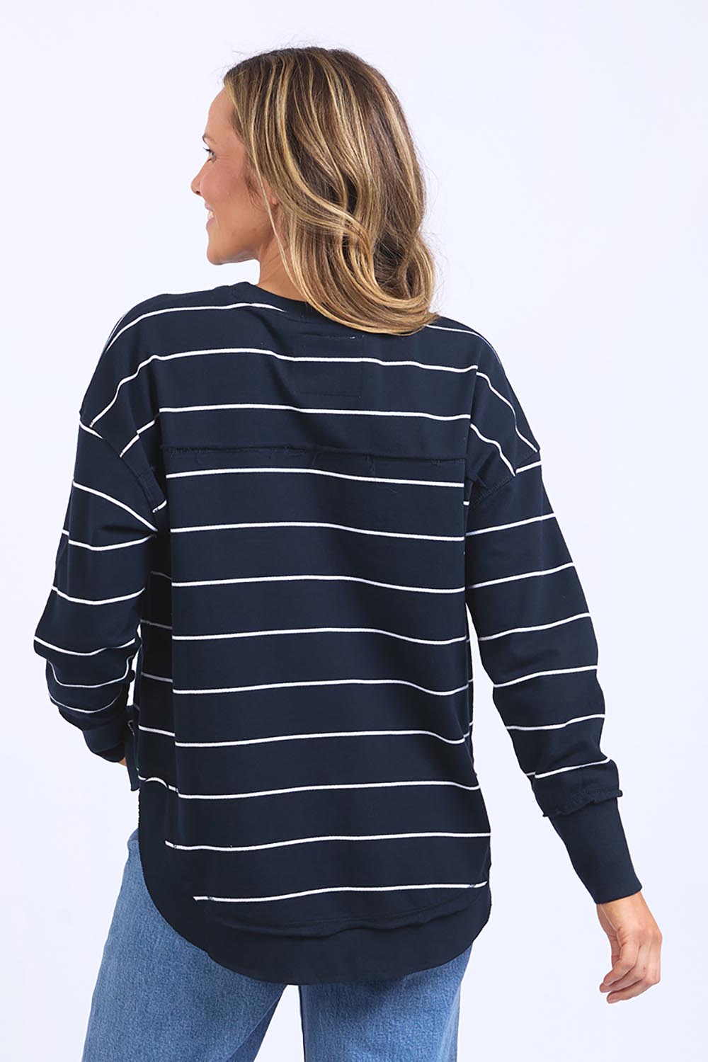 A model wearing the Elements Classic Simplified Stripe Crew in colour Navystripe (Blue), from the back