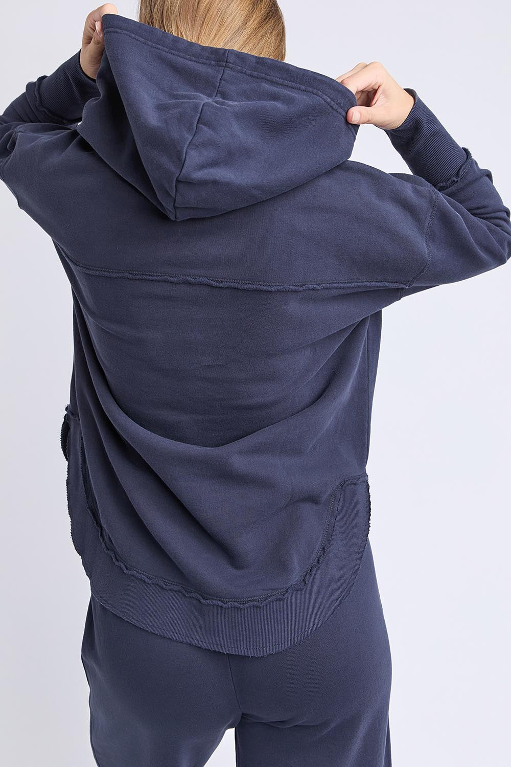 A model wearing the Elements Simplified Cotton Hoodie in colour Navy (Blue), from the back