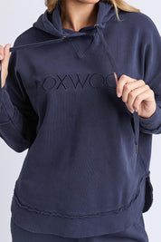 A model wearing the Elements Simplified Cotton Hoodie in colour Navy (Blue), from the front, cropped image