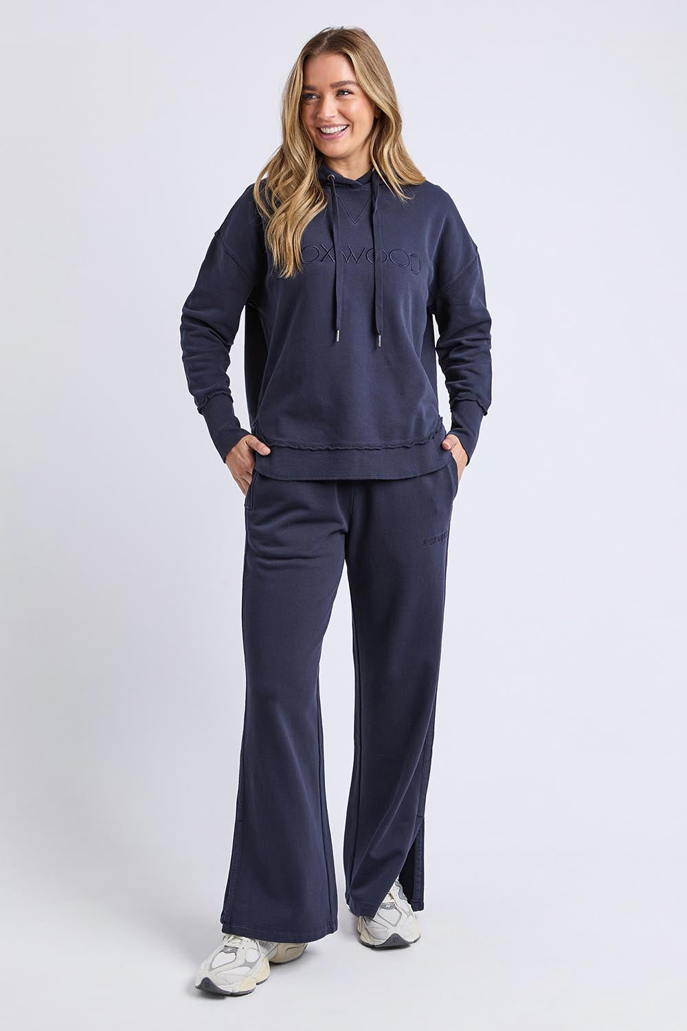 A model wearing the Elements Simplified Cotton Hoodie in colour Navy (Blue), from the front, showing the whole outfit