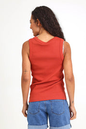 Model Pamelar wearing size 10 of the Elements Iris Rib Cotton Tank – Tabasco in colour Tabasco, from the back