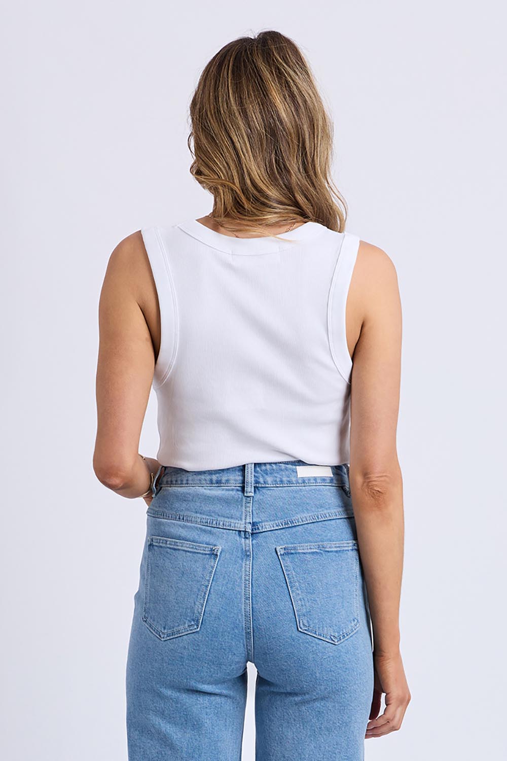 Model Genericm wearing size sample of the Elements Iris Rib Cotton Tank – White in colour White, from the back