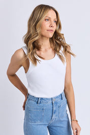 Model Genericm wearing size sample of the Elements Iris Rib Cotton Tank – White in colour White, in a cropped view