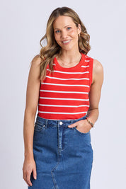 A model wearing the Elements Iris Cotton Tank in colour Tangwhite (Red), from the front, cropped image