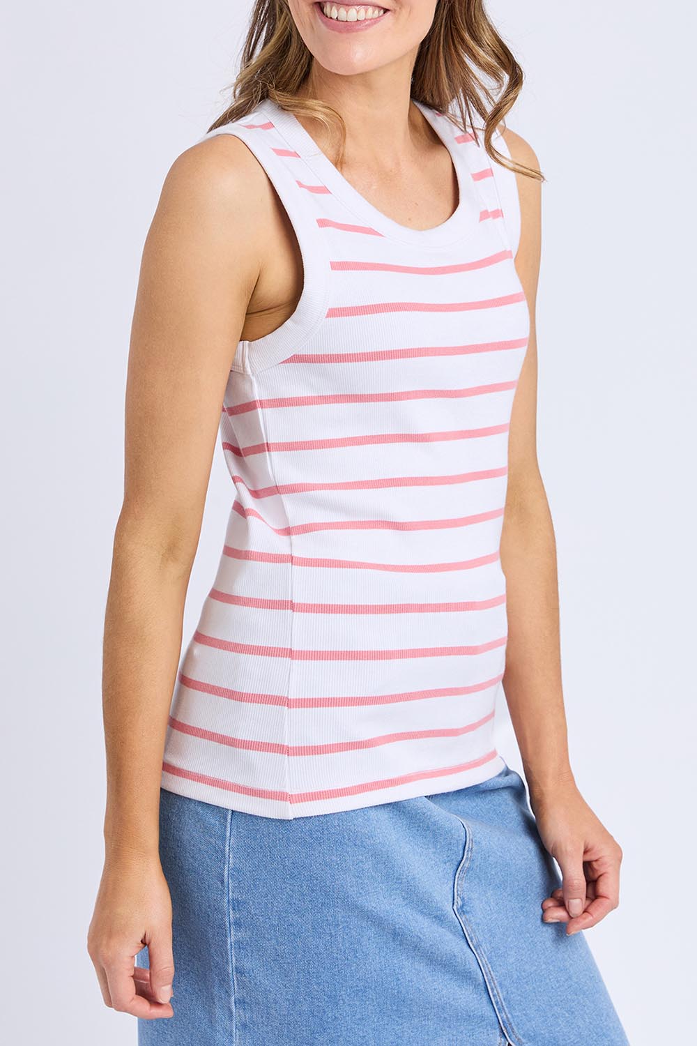 A model wearing the Elements Iris Cotton Tank in colour Whitepink (Pink), from the front, cropped image