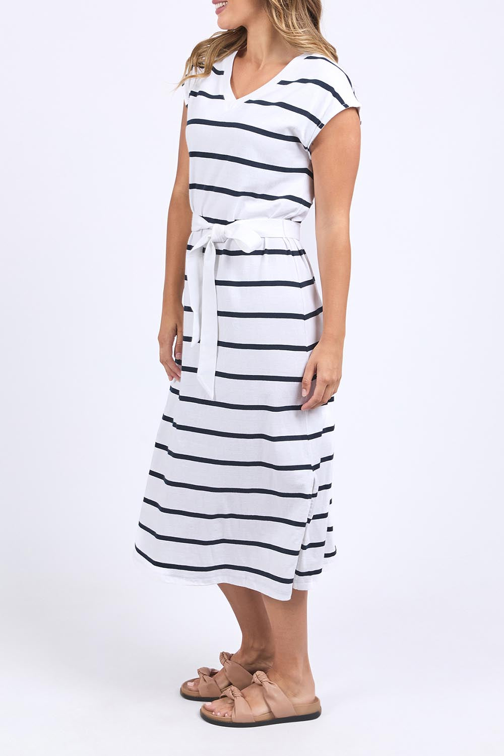 A model wearing the Elements Casey Cotton Stripe Dress in colour Whitenavy (Blue), from the front, cropped image