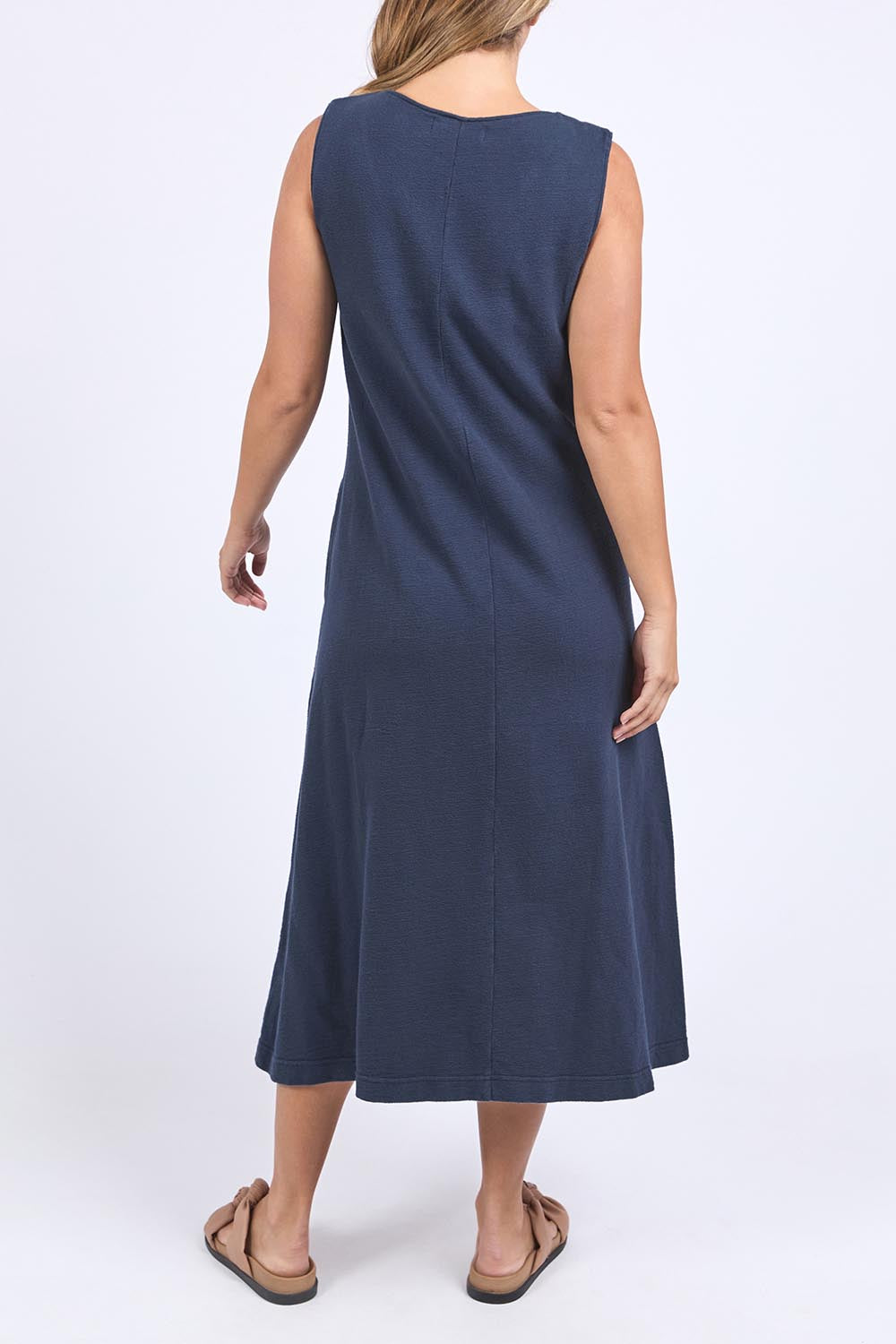 A model wearing the Elements Aspen Cotton Dress in colour Navy (Blue), from the front, cropped image
