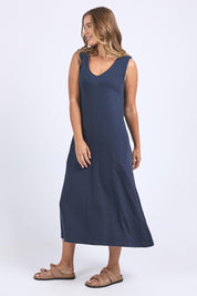 A model wearing the Elements Aspen Cotton Dress in colour Navy (Blue), from the front, showing the whole outfit