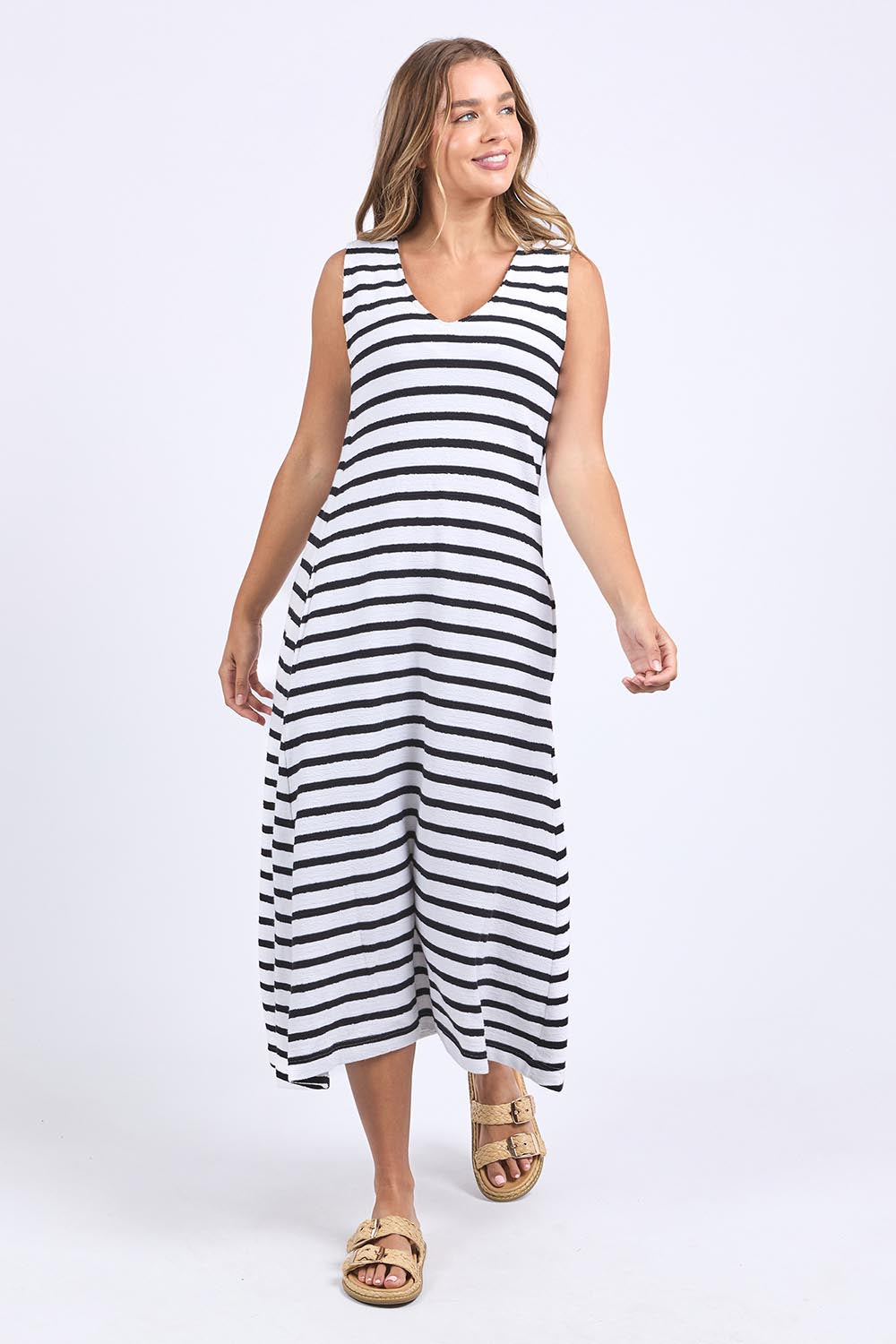 A model wearing the Elements Aspen Stripe Cotton Dress in colour White (White), from the front, showing the whole outfit