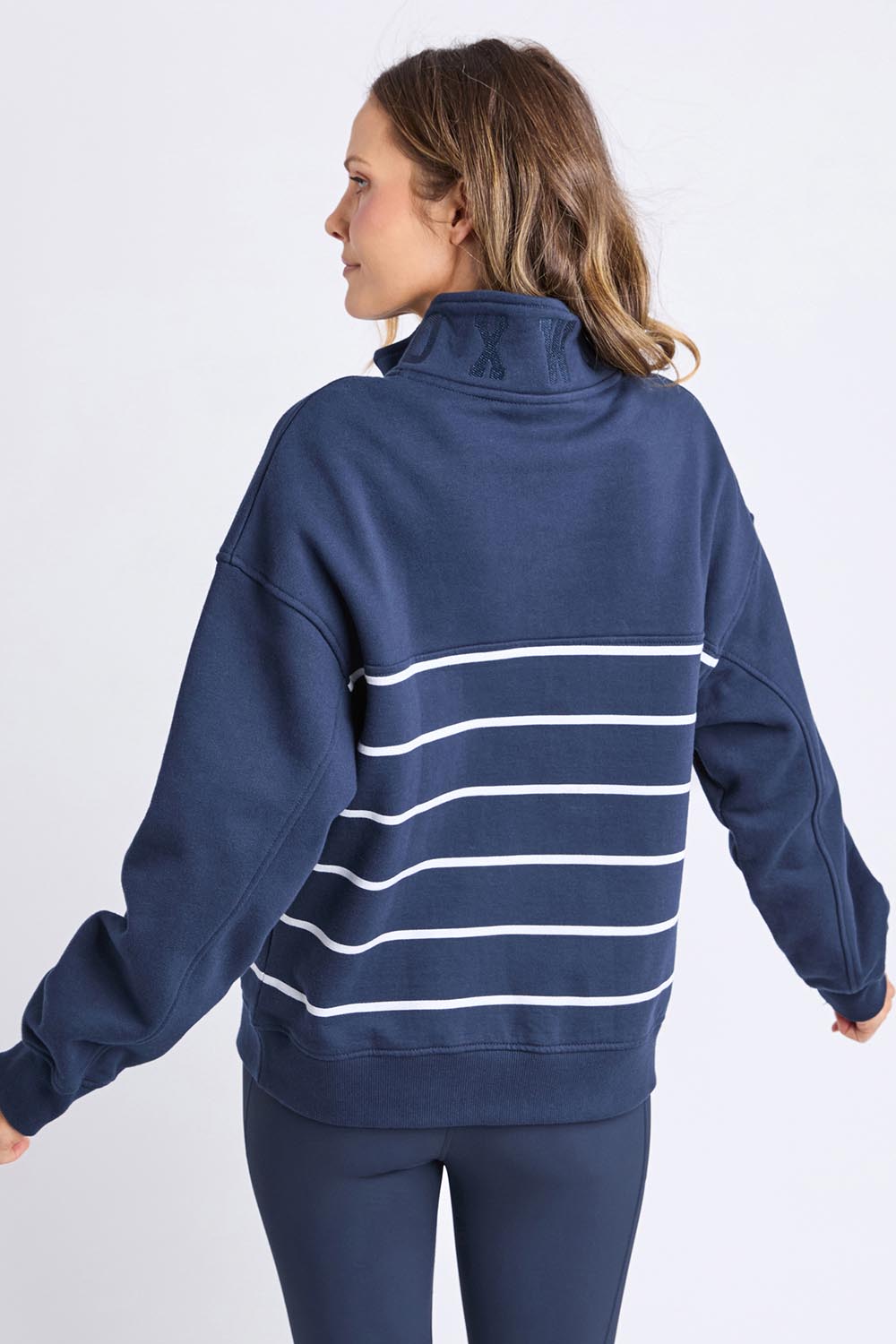 A model wearing the Elements Cotton College Zip Crew in colour Navystripe (Blue), from the back