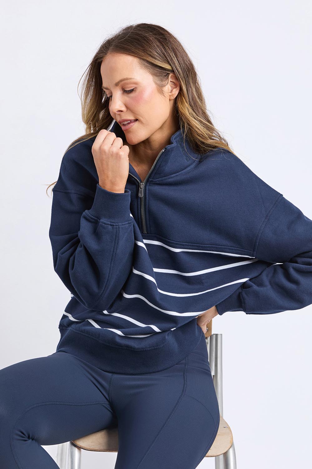 A model wearing the Elements Cotton College Zip Crew in colour Navystripe (Blue), from the front, cropped image
