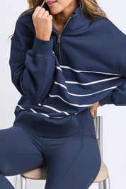 A model wearing the Elements Cotton College Zip Crew in colour Navystripe (Blue), from the front, cropped image