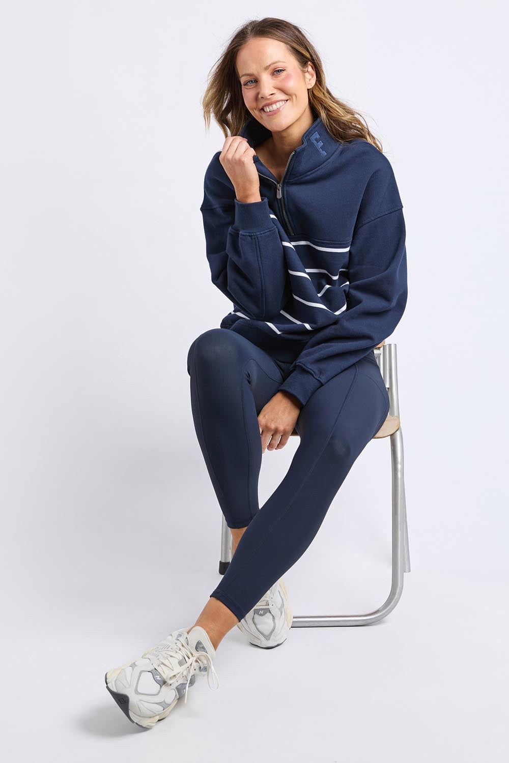 A model wearing the Elements Cotton College Zip Crew in colour Navystripe (Blue), from the front, showing the whole outfit